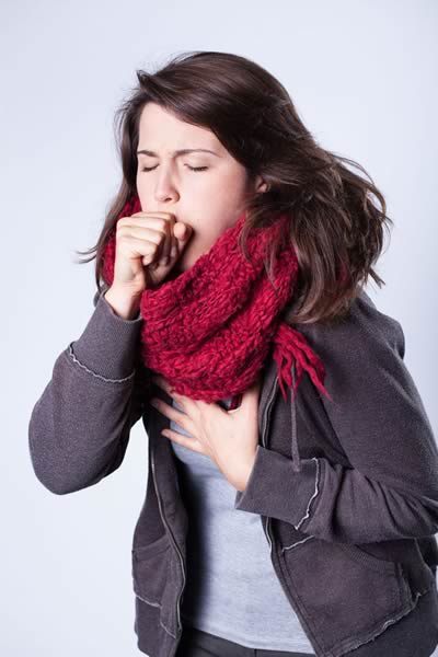 Woman coughing.