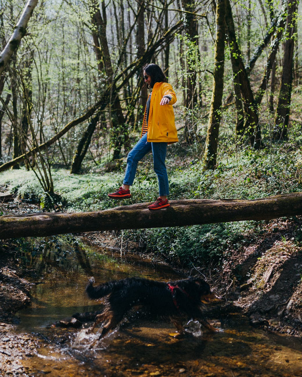 Woman balancing on a log